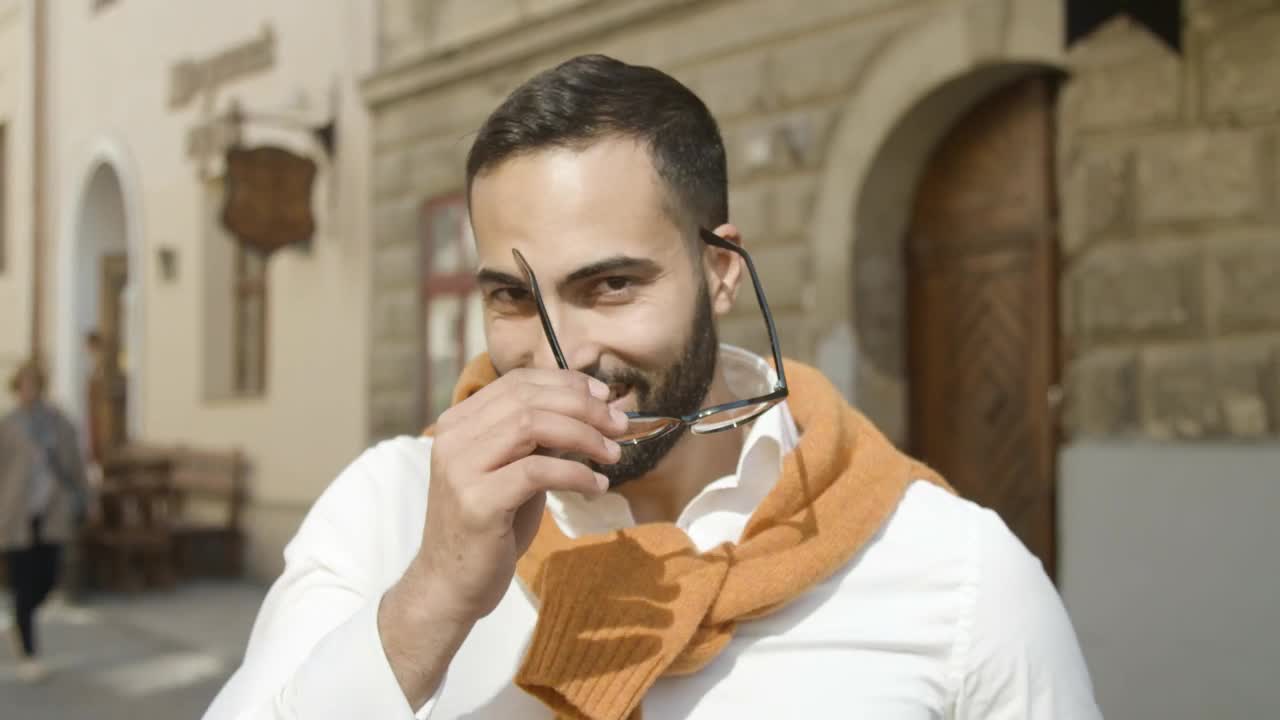 Stock Video Handsome Arab Man Takes Off Glasses And Smiles Animated Wallpaper