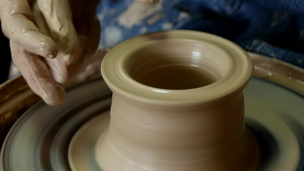 Stock Video Hands Working On Spinning Clay Animated Wallpaper