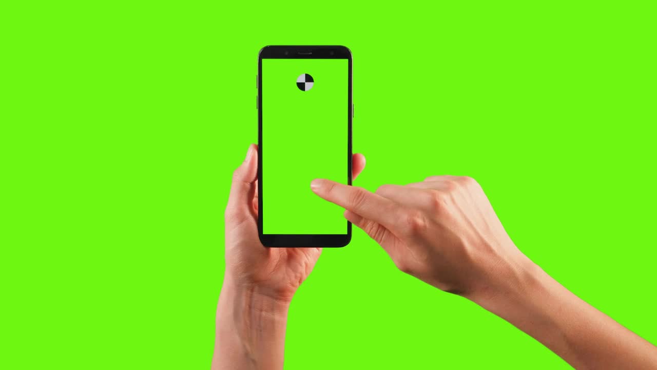 Stock Video Hands Using A Cellphone With Tracking Point On A Green Animated Wallpaper