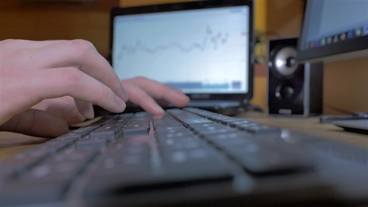 Stock Video Hands Typing On A Black Keyboard On A Desk Animated Wallpaper
