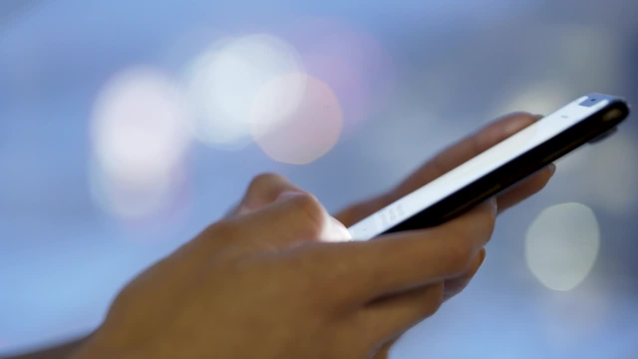 Stock Video Hands Texting On A Mobile Phone At Night Animated Wallpaper