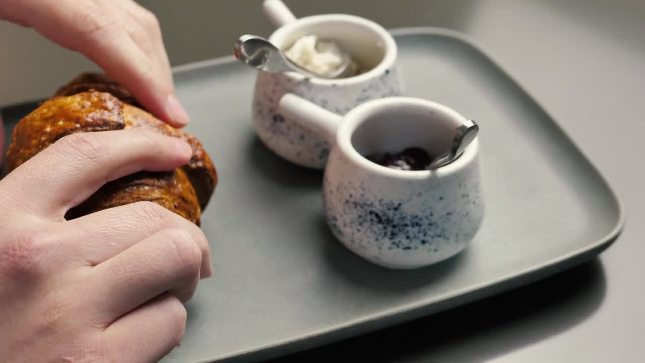 Stock Video Hands Splitting A Croissant In Half Animated Wallpaper