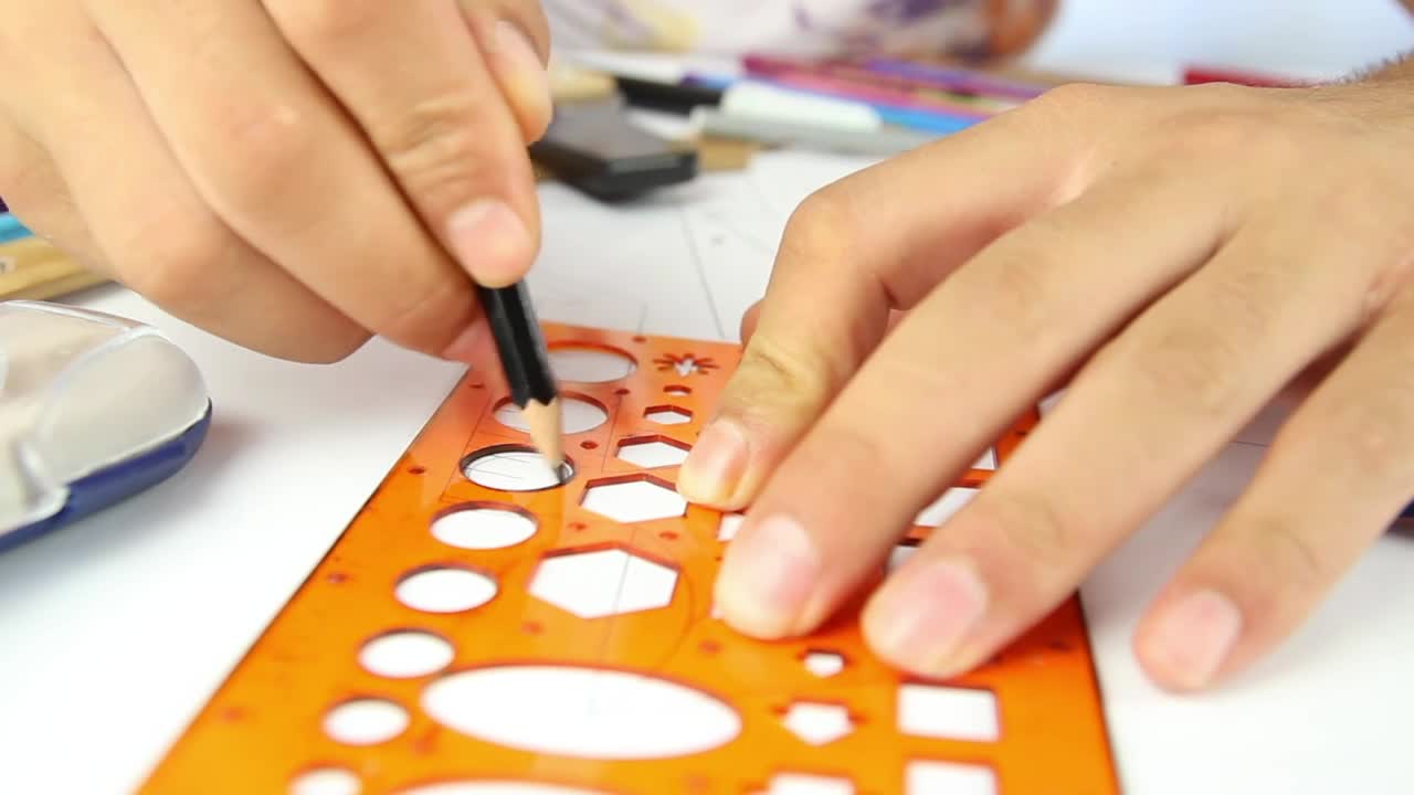 Stock Video Hands Of A Person Drawing Circles With A Template Animated Wallpaper