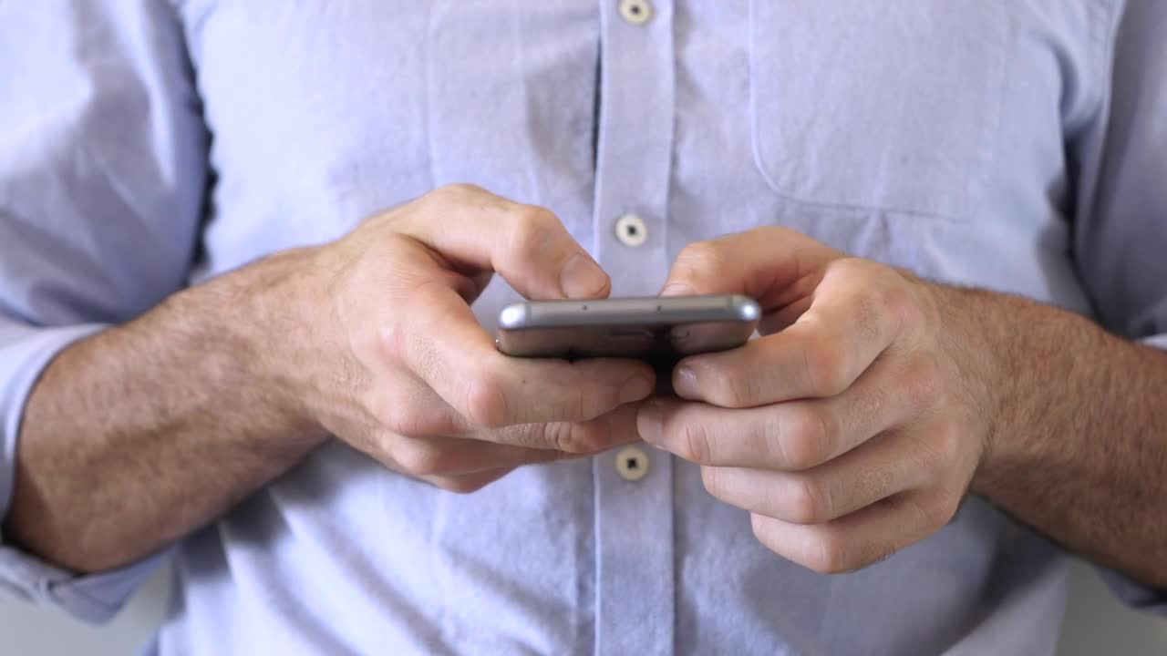 Stock Video Hands Of A Man Using A Smartphone Animated Wallpaper