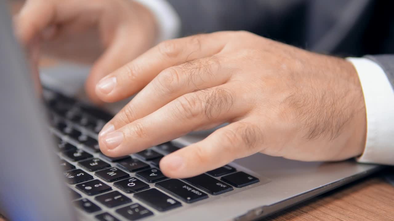 Stock Video Hands Of A Man Typing On A Laptop Animated Wallpaper