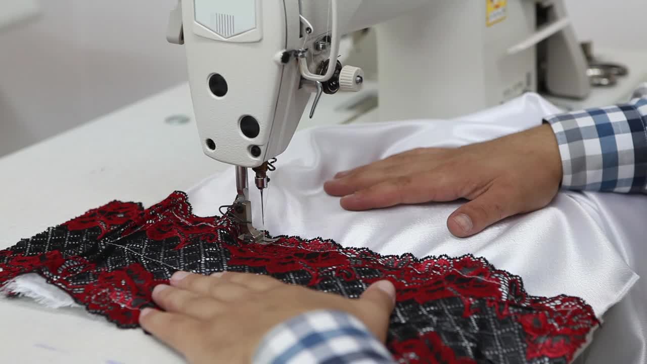 Stock Video Hands Of A Man Sewing On A Machine Animated Wallpaper