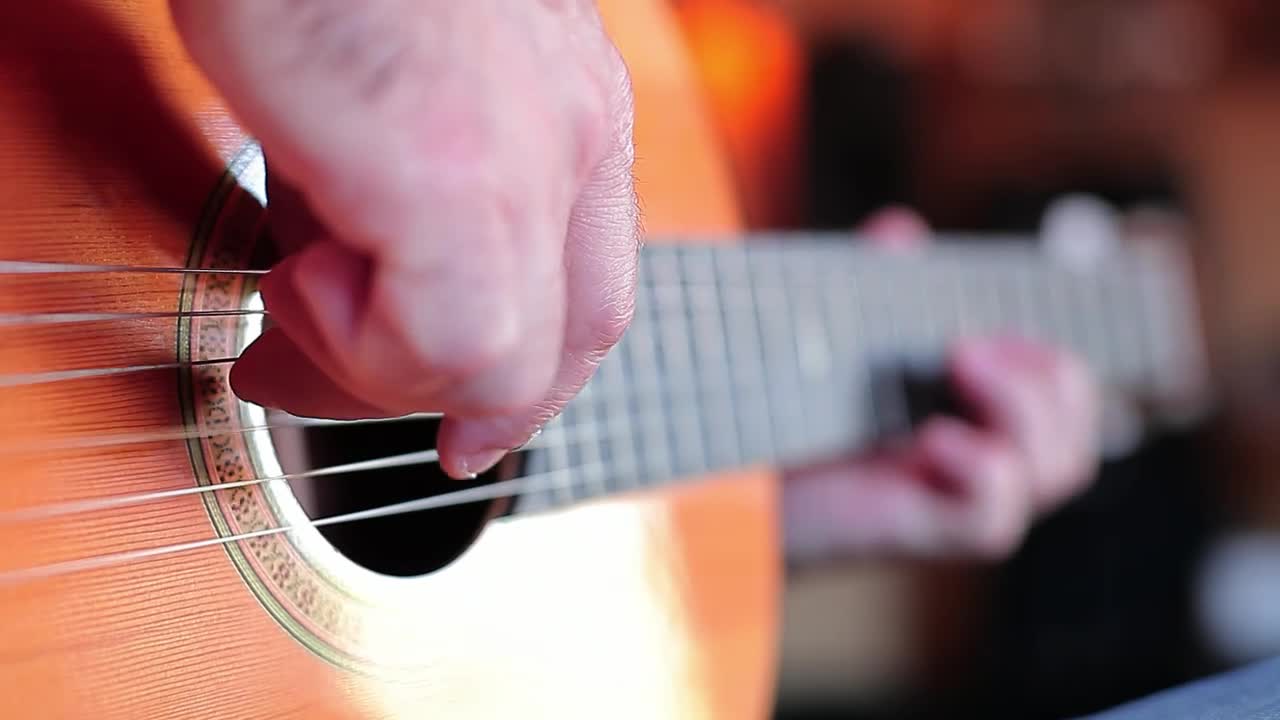 Stock Video Hands Of A Man Playing The Guitar Animated Wallpaper