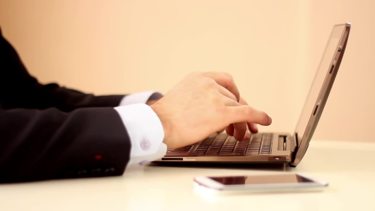 Stock Video Hands Of A Man In Suit Working On A Computer Animated Wallpaper