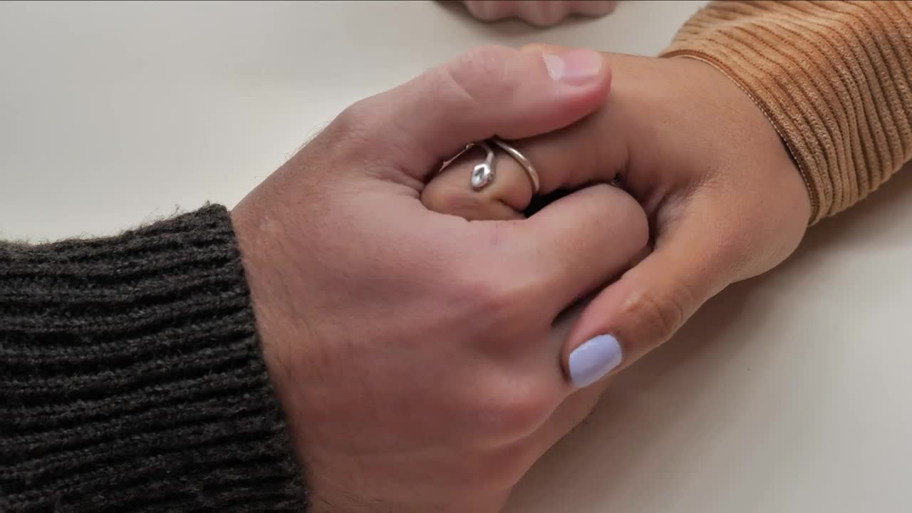 Stock Video Hands Of A Loving Couple Animated Wallpaper