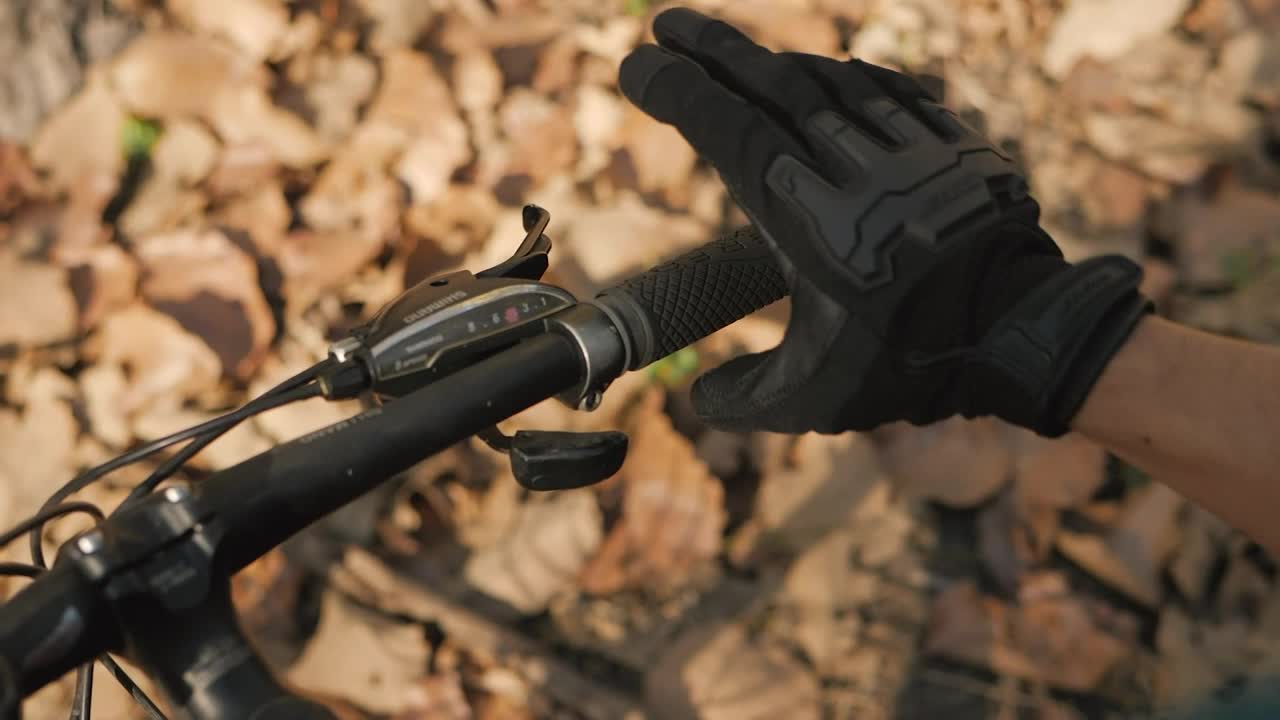 Stock Video Hands Of A Cyclist Taking The Handlebars Of His Bicycle Animated Wallpaper