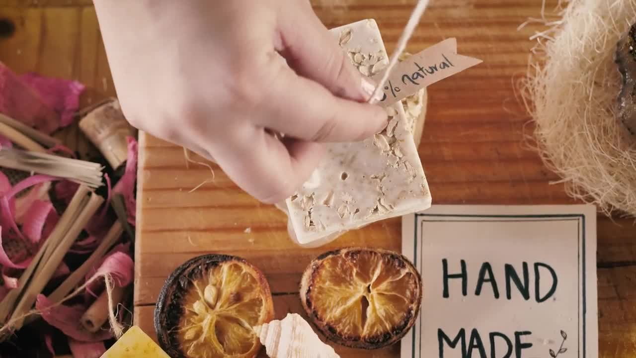 Stock Video Hands Labeling A Handmade Soap Animated Wallpaper