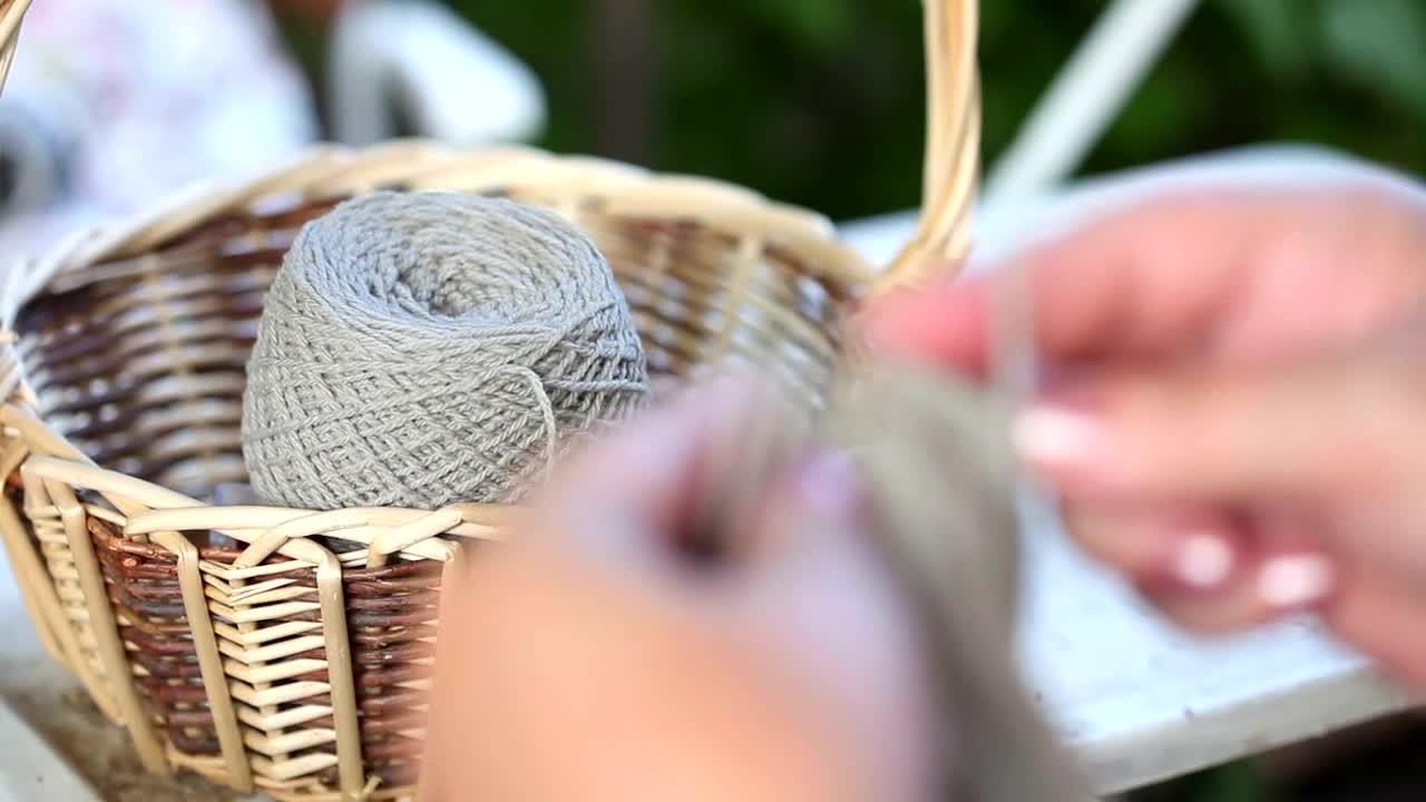 Stock Video Hands Knitting With Big Needles Animated Wallpaper