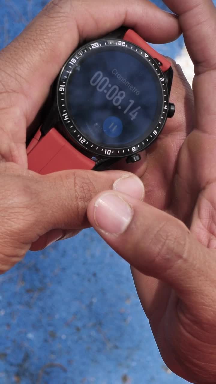 Stock Video Hands Holding A Smart Watch With The Stopwatch Running Animated Wallpaper