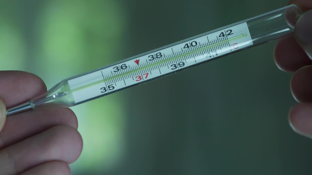 Stock Video Hands Holding Thermometer Animated Wallpaper