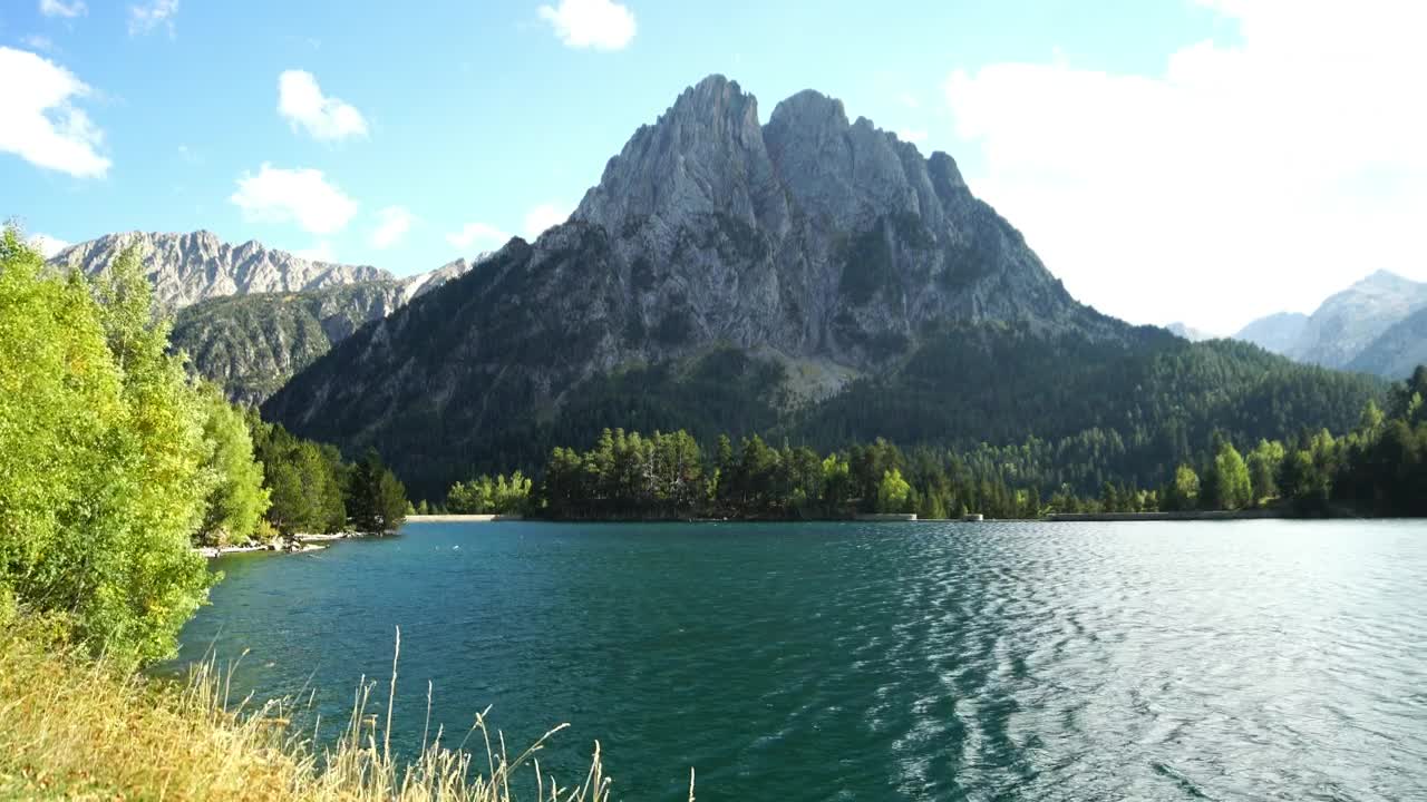 Stock Video Landscape Of A River Flowing Near A Mountain Animated Wallpaper