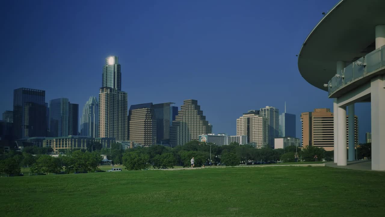 Stock Video Landscape Of A Meadow Surrounded By Trees And Buildings Animated Wallpaper