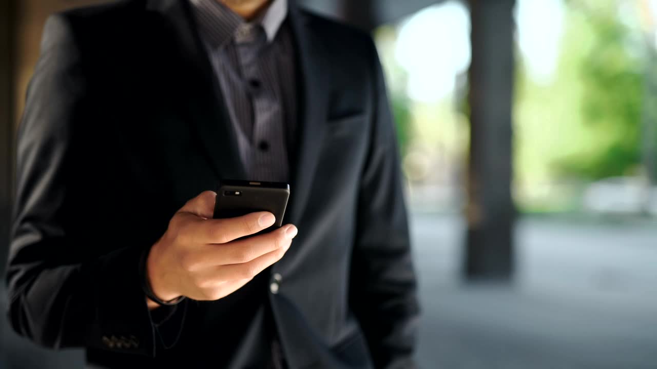 Stock Video Man In Suit Checks Time And Makes Phone Call Animated Wallpaper