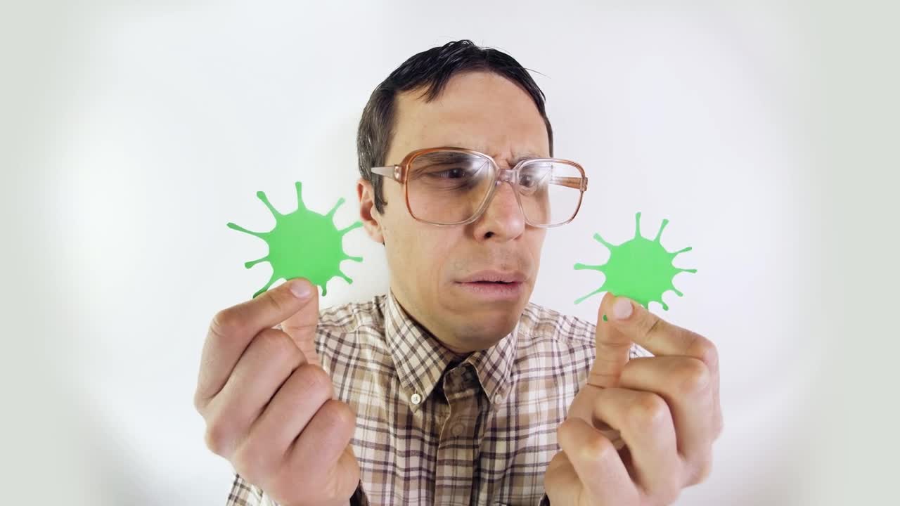 Stock Video Man In Glasses Looking At Forms Of Coronavirus Animated Wallpaper