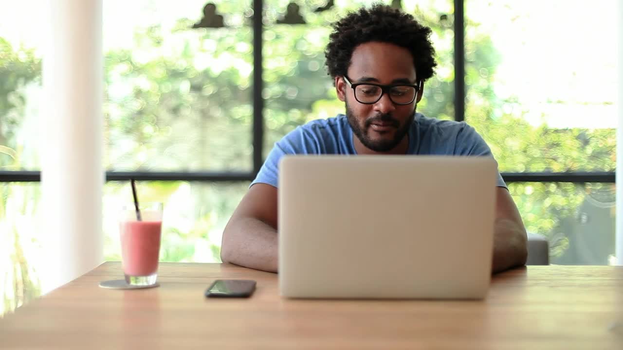 Stock Video Man In Front Of Computer Working From Home Animated Wallpaper