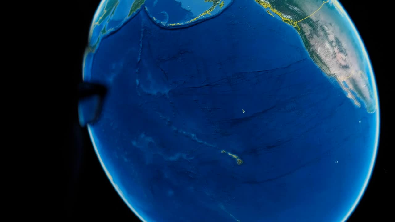 Stock Video Man In Front Of A Computer While Using Google Earth Animated Wallpaper