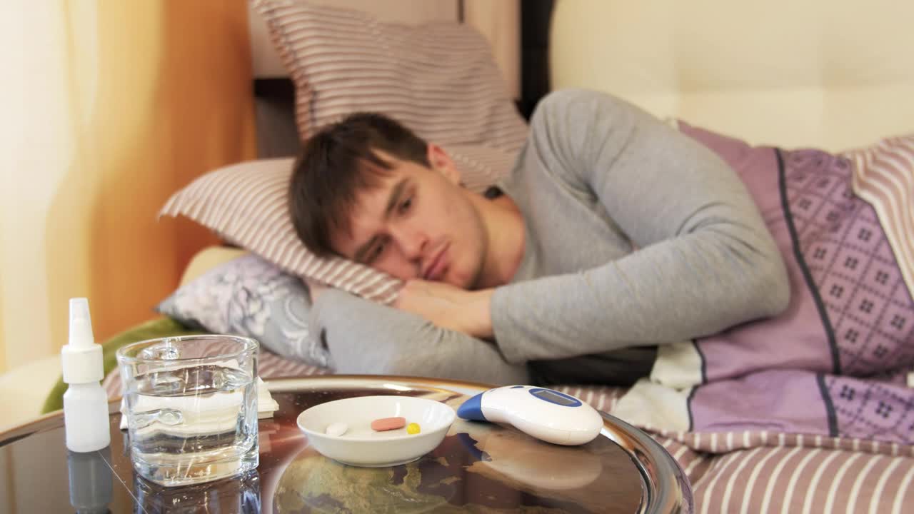 Stock Video Man In Bed With A High Temperature Animated Wallpaper
