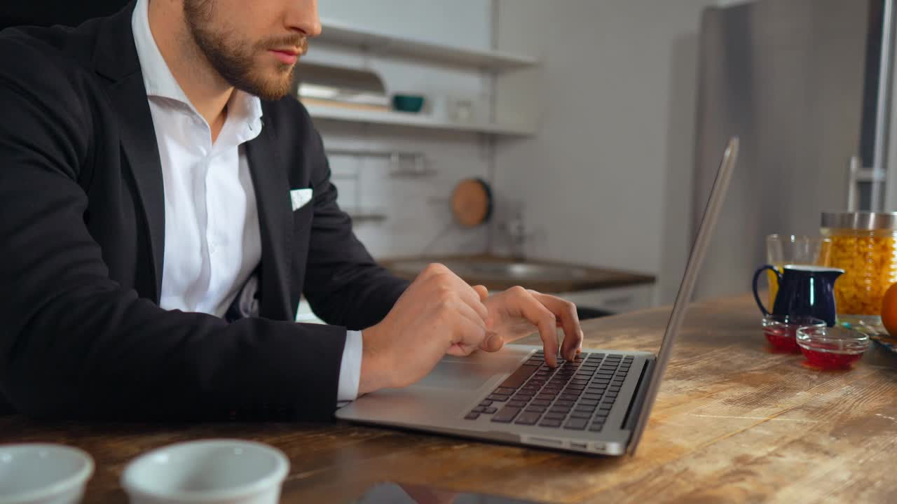 Stock Video Man In A Suit Works From The Kitchen Animated Wallpaper
