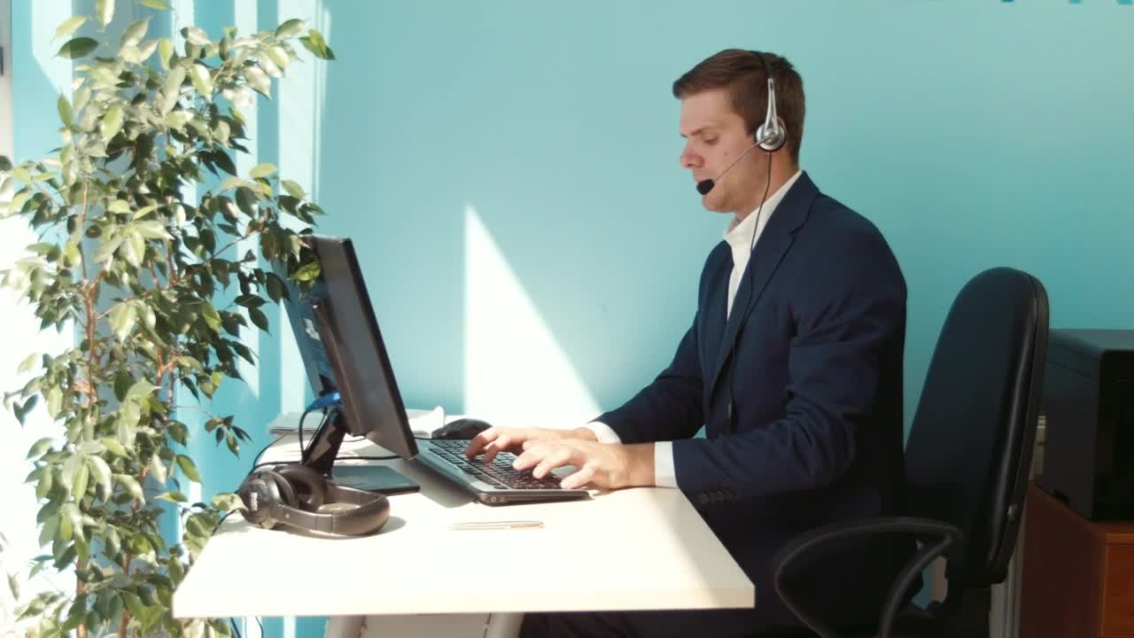 Stock Video Man In A Suit Working In An Office With A Animated Wallpaper