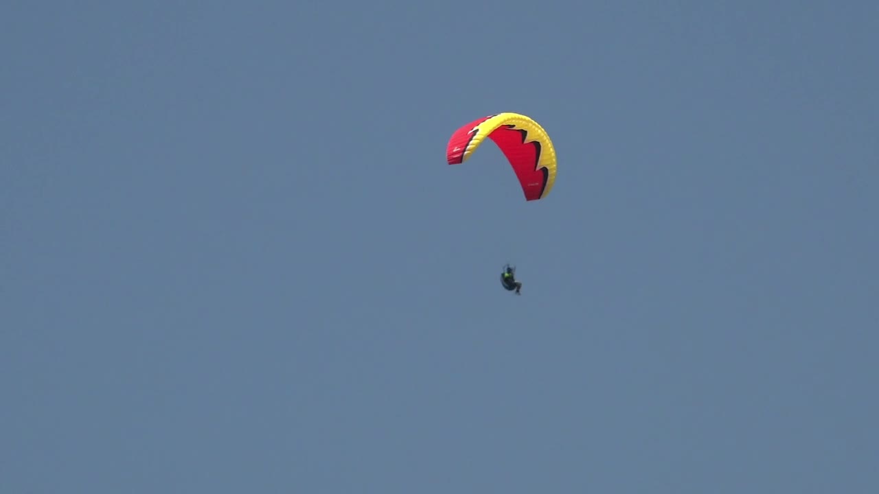Stock Video Man In A Red Paraglide In The Sky Animated Wallpaper