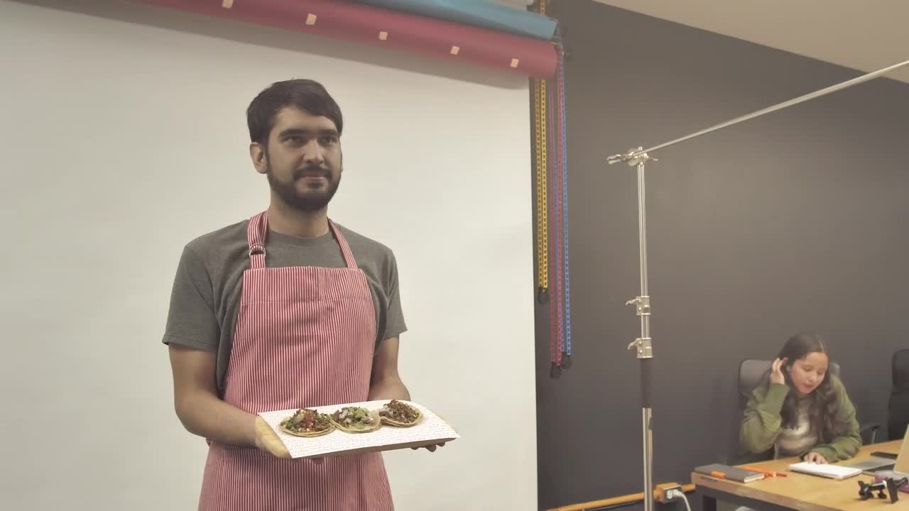 Stock Video Man In A Photo Studio Holding Food Animated Wallpaper