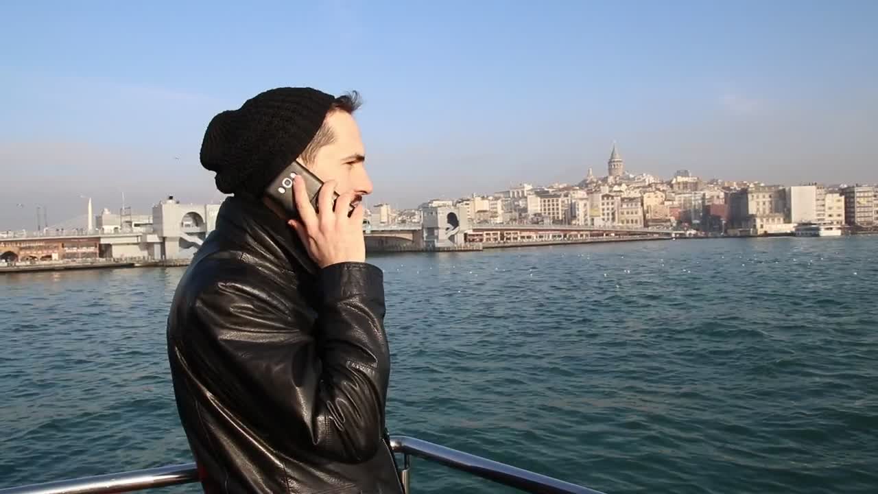 Stock Video Man In A Call Standing On A Boat Animated Wallpaper