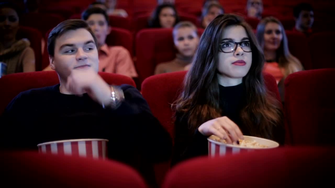 Stock Video Man Hugging His Date At The Cinema Animated Wallpaper