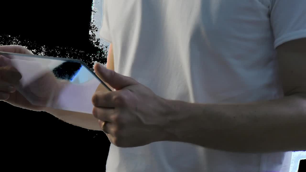 Stock Video Man Holding And Using A Futuristic Tablet Animated Wallpaper
