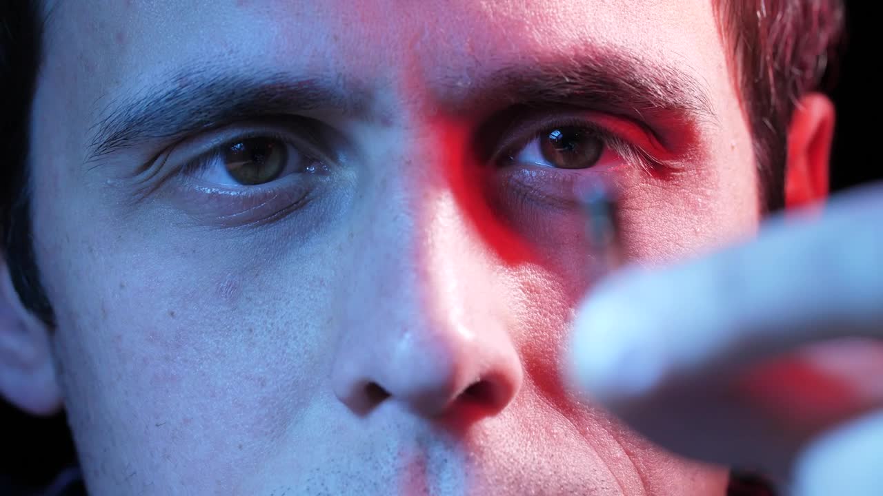 Stock Video Man Holding A Small Microchip Animated Wallpaper