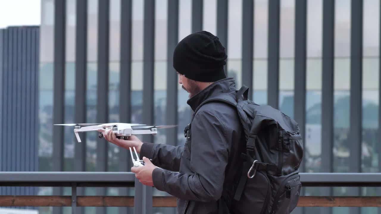 Stock Video Man Holding A Drone Animated Wallpaper