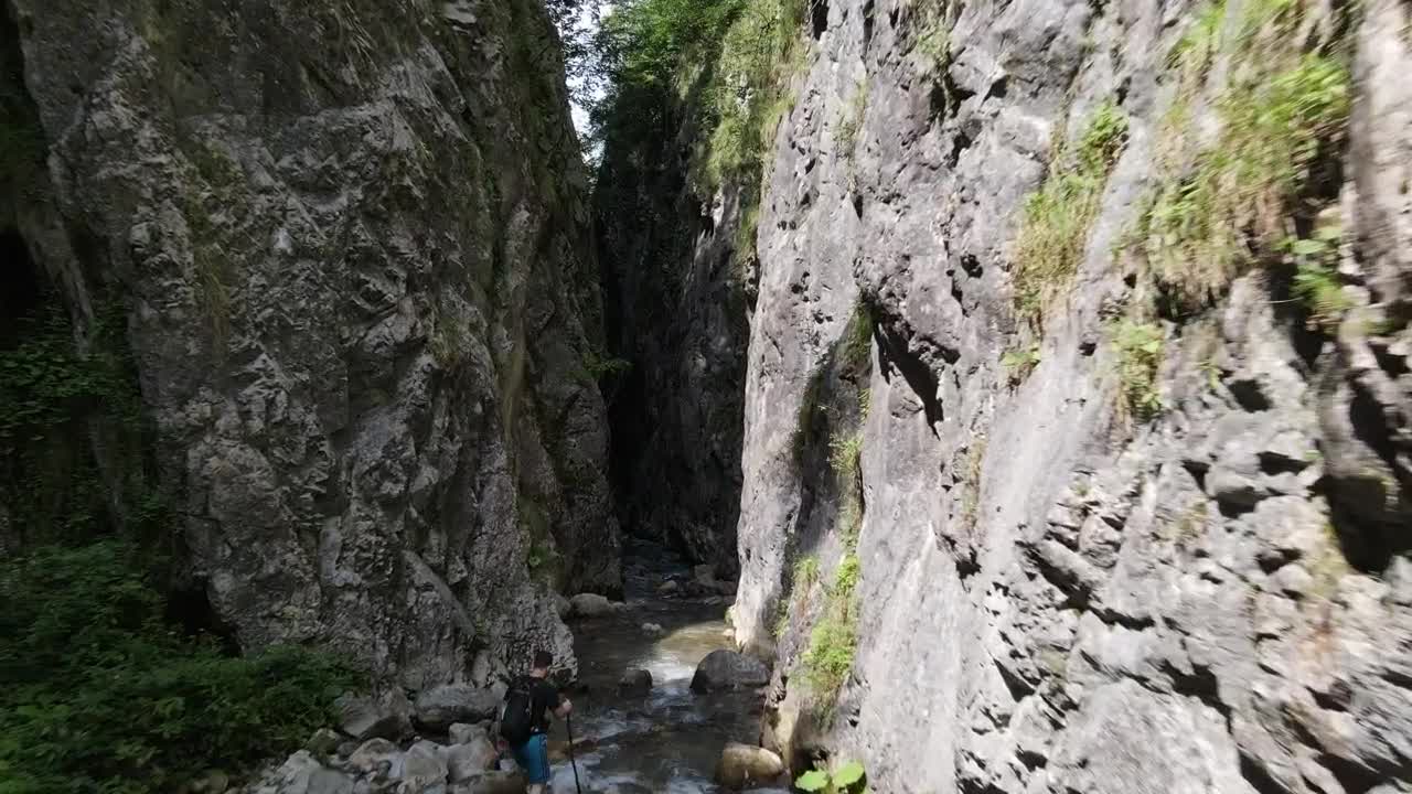 Stock Video Man Hiking In A Canyon River Animated Wallpaper