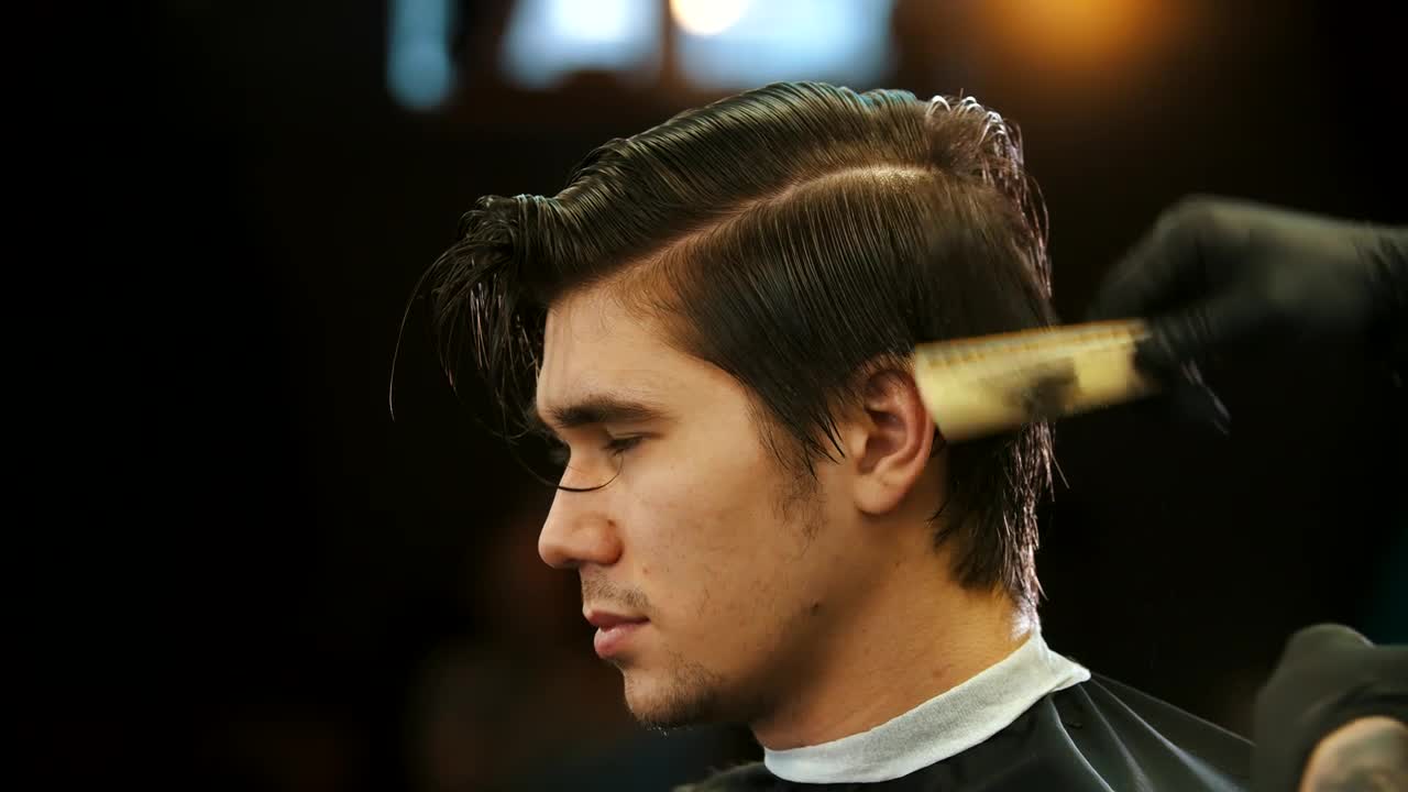 Stock Video Man Having A Haircut At The Barber Close Up Animated Wallpaper