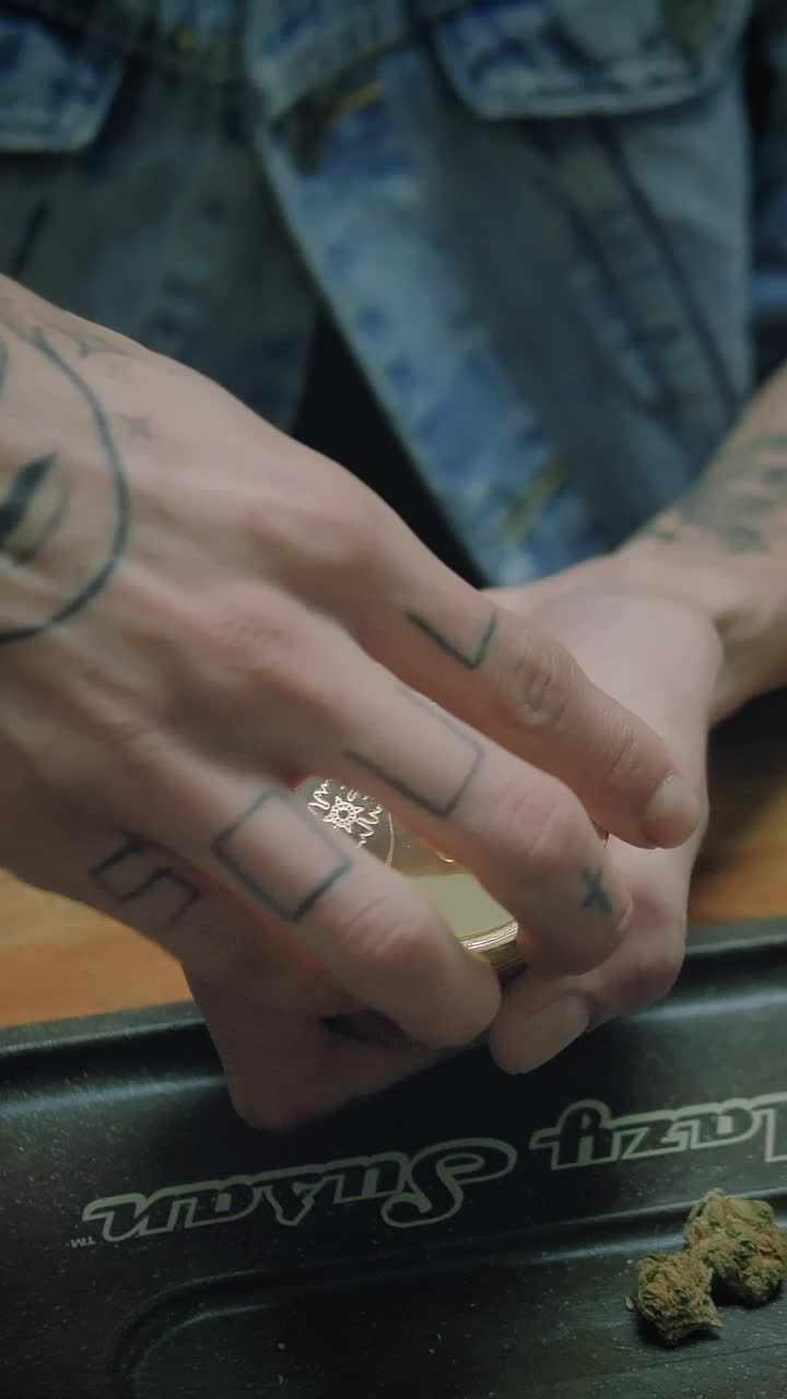 Stock Video Man Grinding Weed In A Grinder Animated Wallpaper