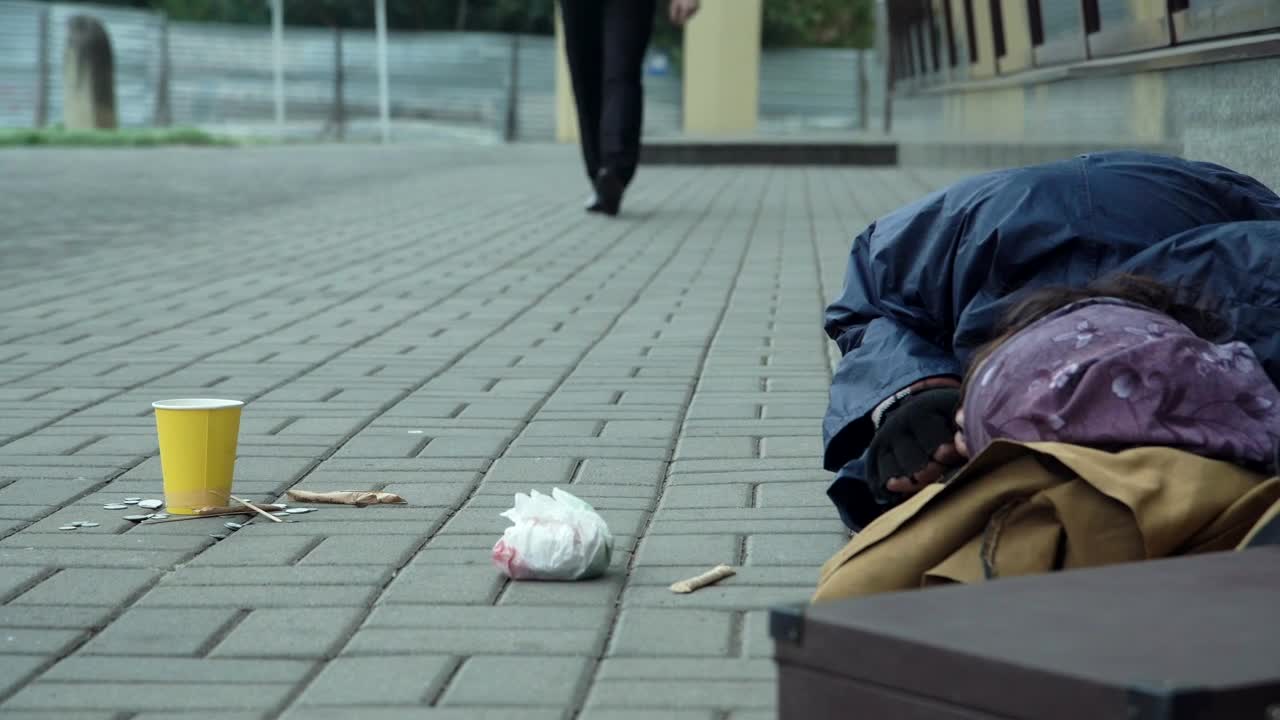 Stock Video Man Giving Coins To Homeless Person Animated Wallpaper
