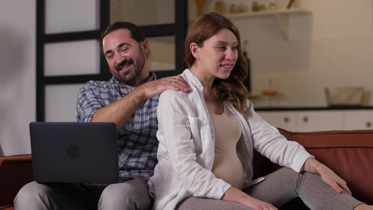 Stock Video Man Giving A Massage To His Pregnant Wife Animated Wallpaper