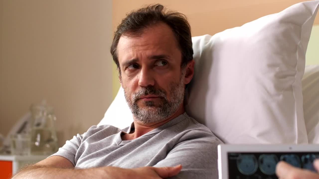 Stock Video Man Given Bad News By Their Doctor Animated Wallpaper