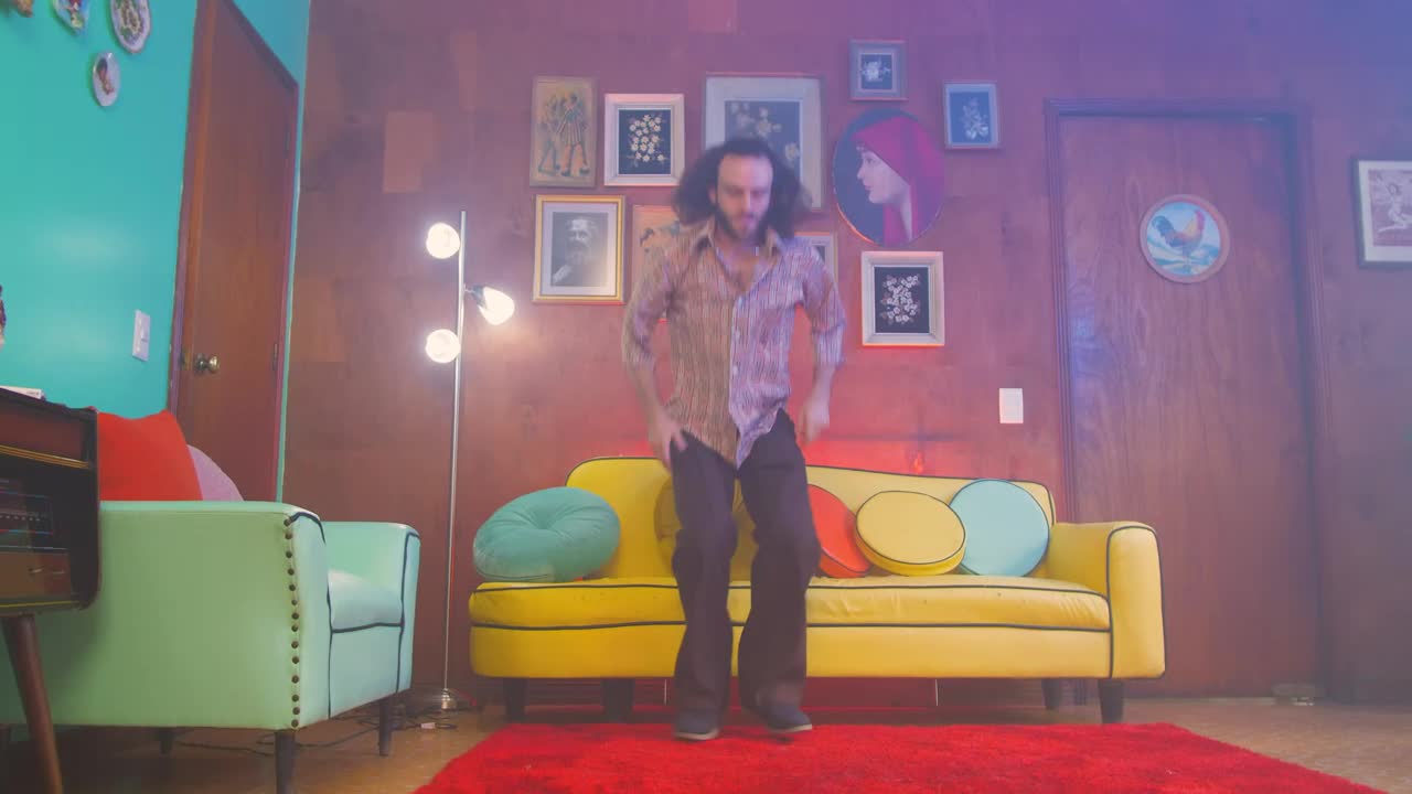 Stock Video Man Gets Up From An Armchair And Begins To Dance Animated Wallpaper