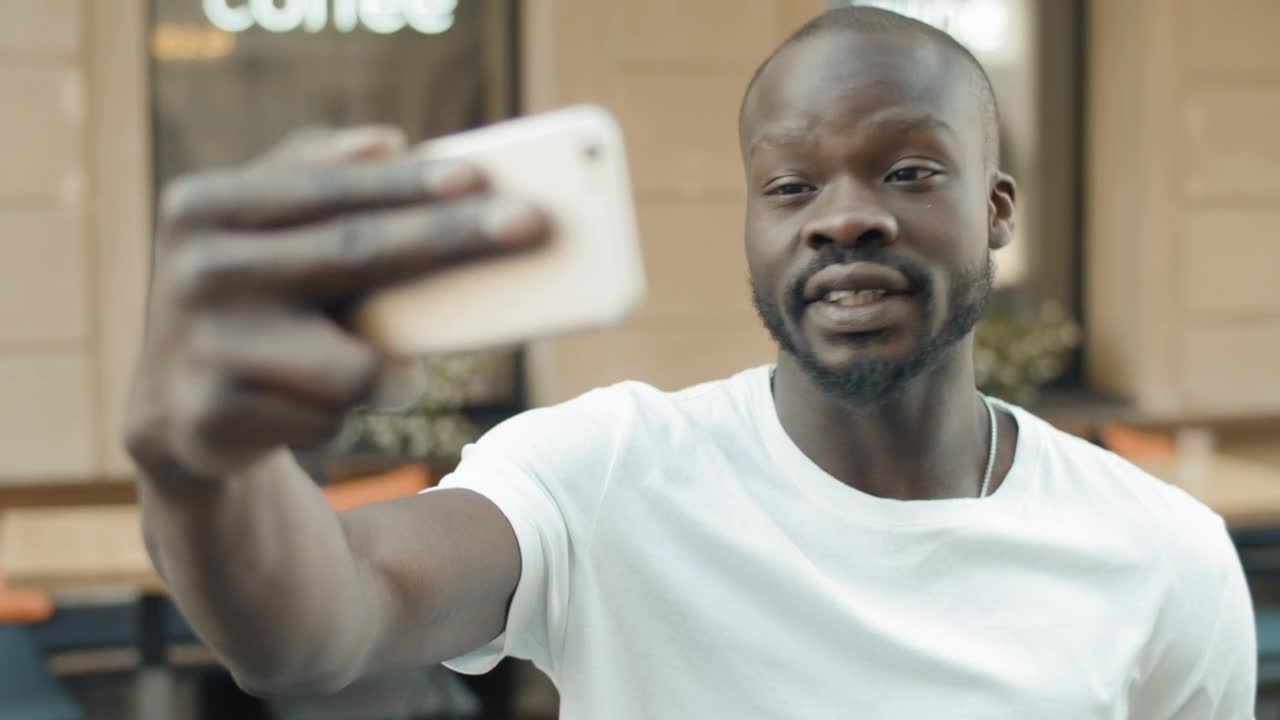 Stock Video Man Gets Emotional On Mobile Video Call Animated Wallpaper