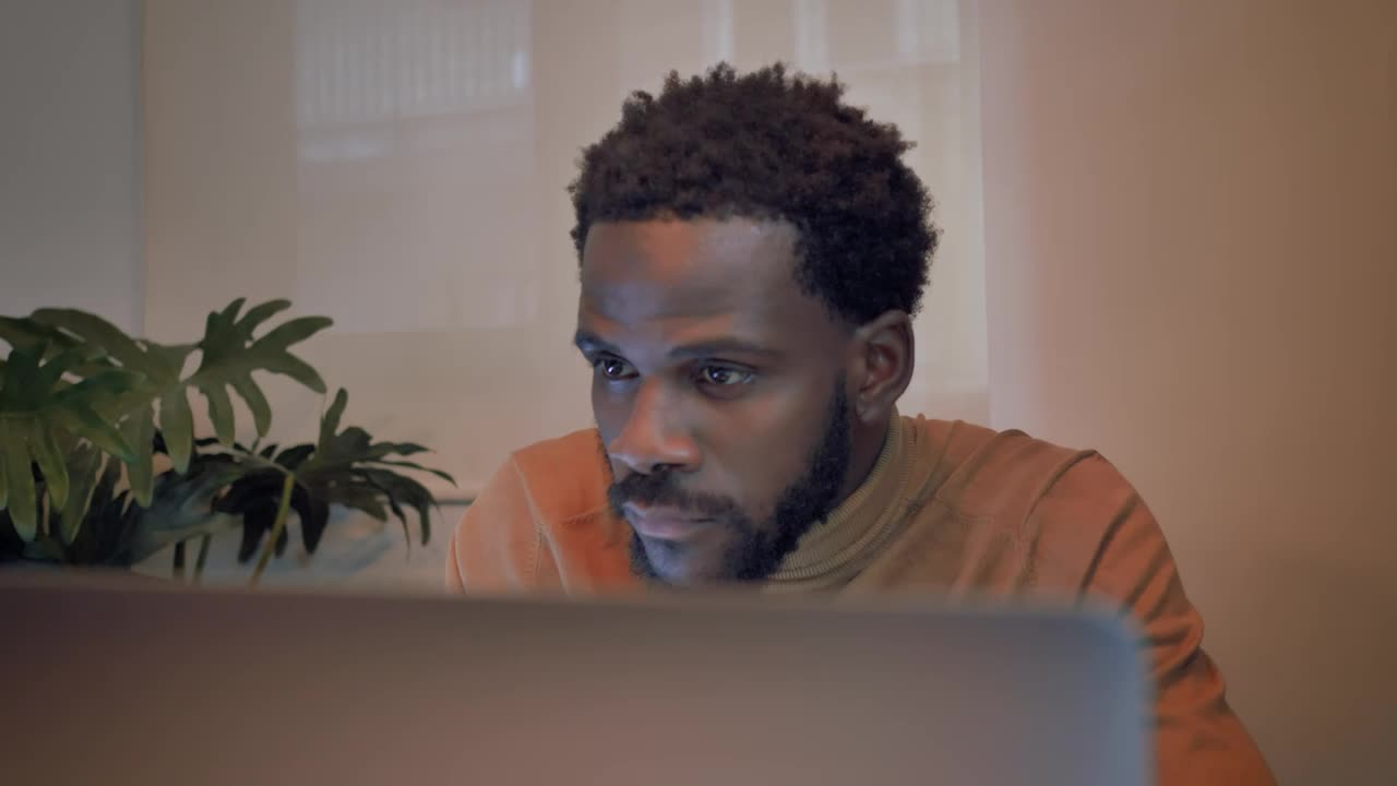 Stock Video Man Finishing Work On His Laptop Animated Wallpaper