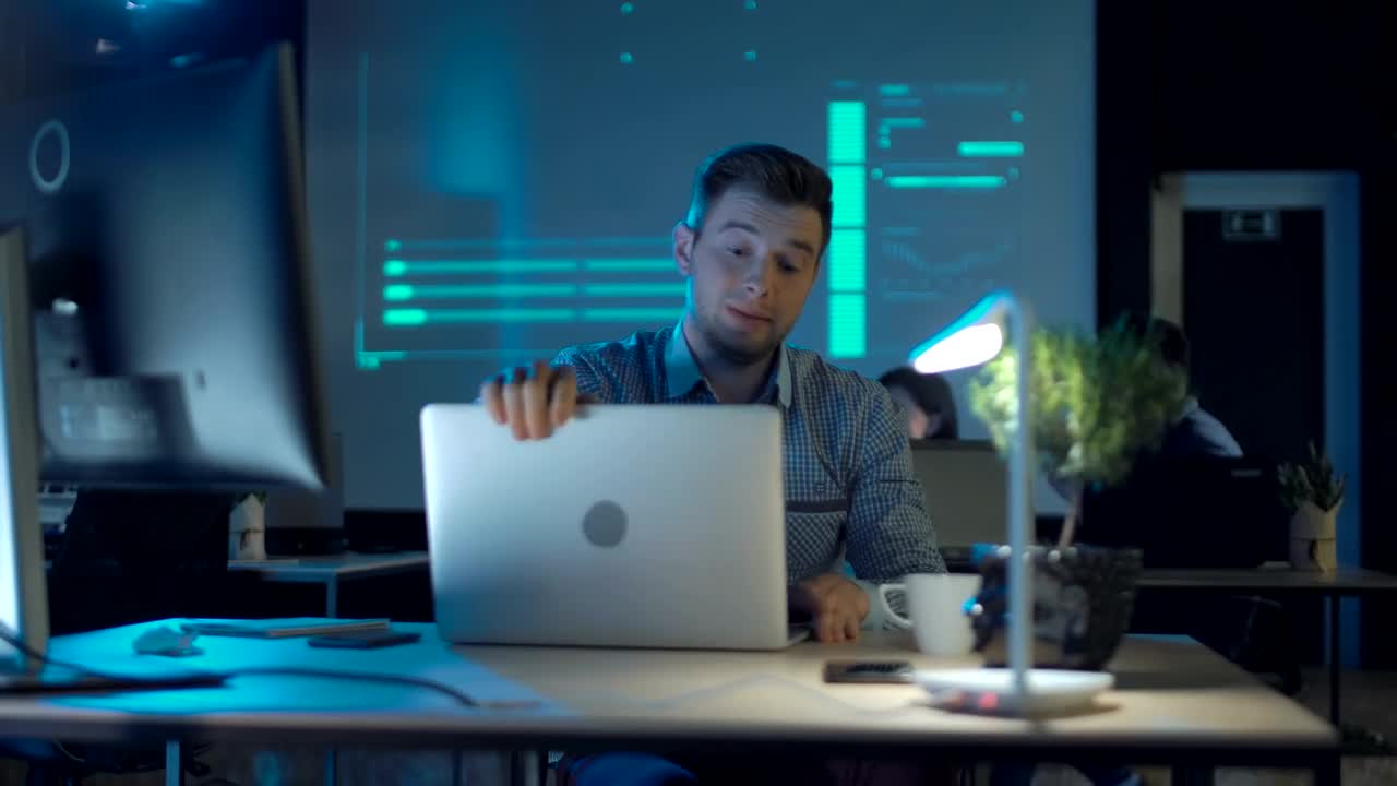 Stock Video Man Fed Up With Work In The Office Drinks Coffee Animated Wallpaper