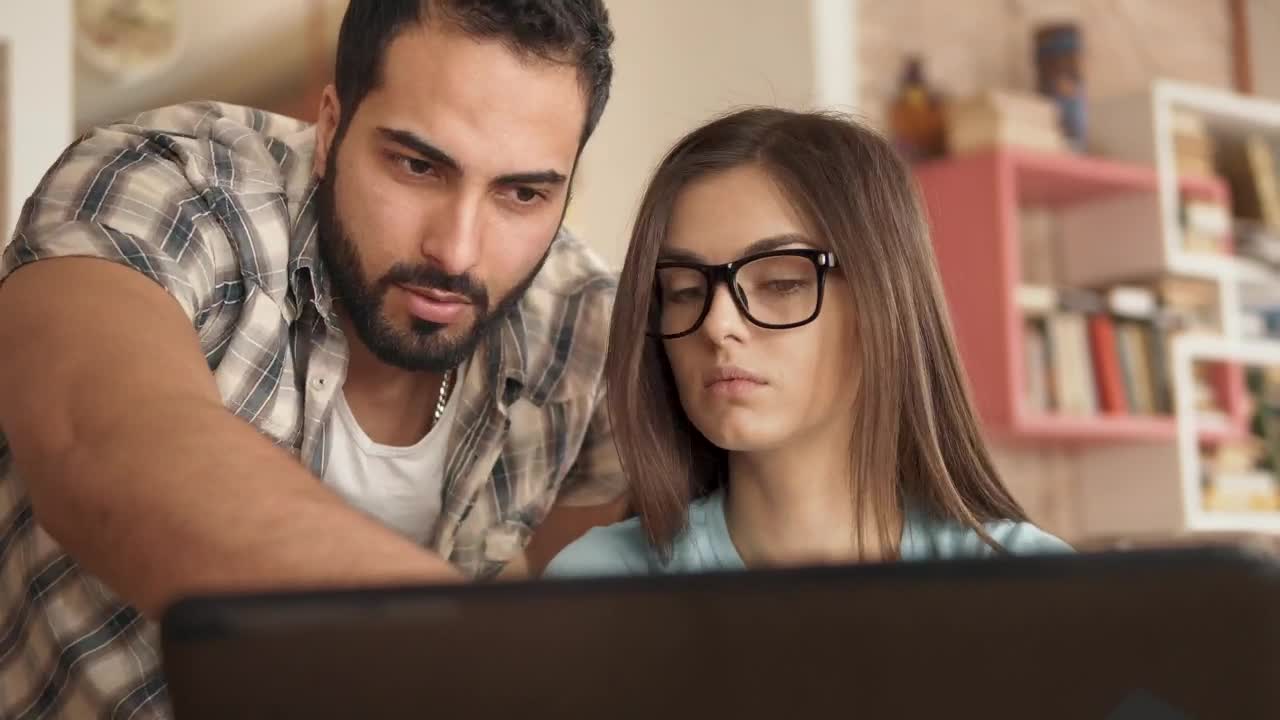 Stock Video Man Explains Idea To Creative Partner And Points At Screen Animated Wallpaper