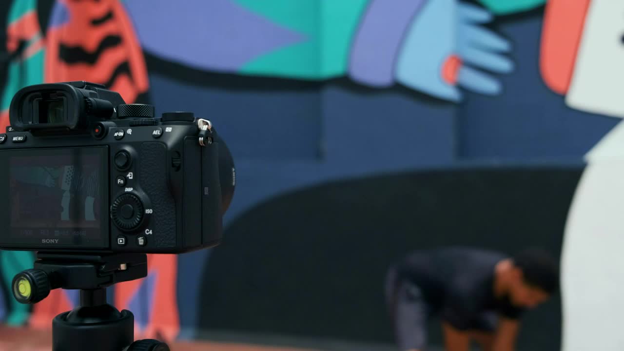 Stock Video Man Exercising While Videotaping Animated Wallpaper