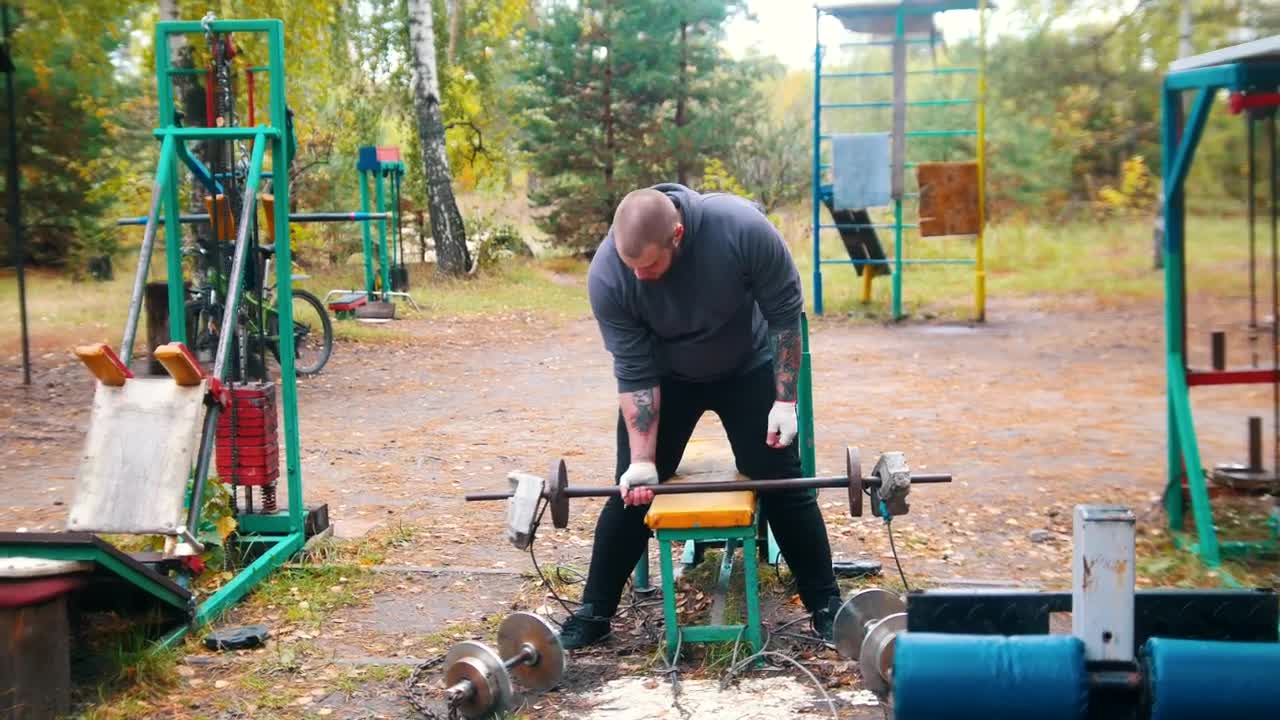Stock Video Man Exercising In A Gym Outdoors Animated Wallpaper