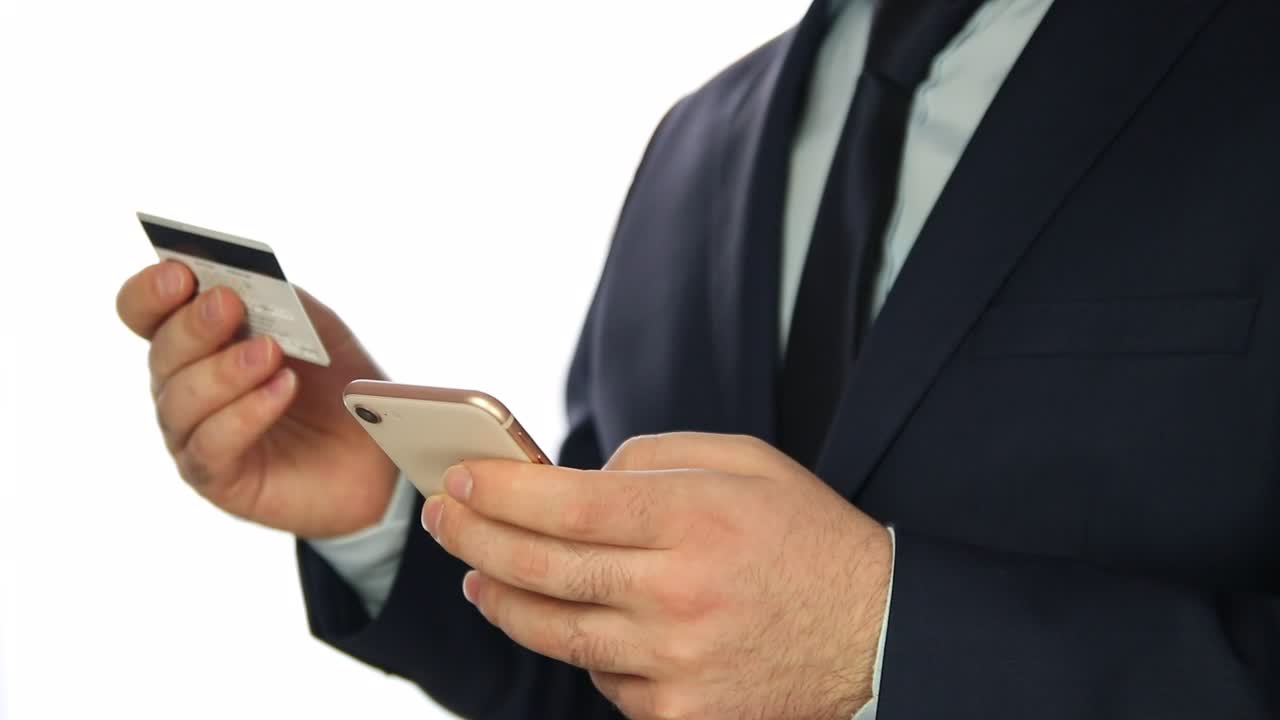 Stock Video Man Entering Bank Data In A Cellphone Animated Wallpaper