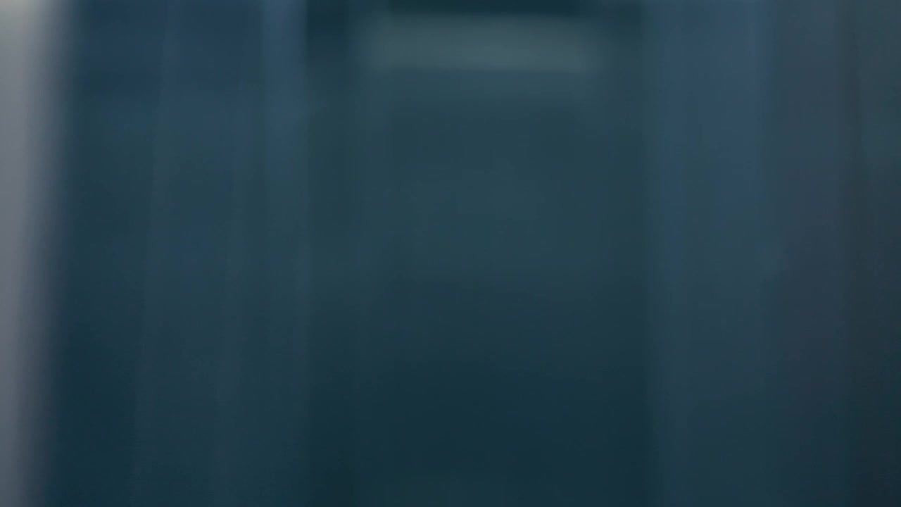 Stock Video Man Entering An Elevator While Talking On The Phone Animated Wallpaper