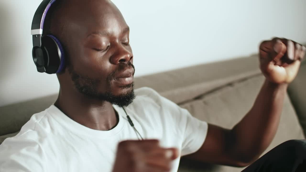 Stock Video Man Enjoying His Favorite Song Animated Wallpaper